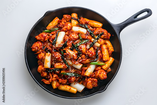 Delicious Korean Dakgalbi Served in a Cast Iron Pan with Vegetables and Spicy Sauce