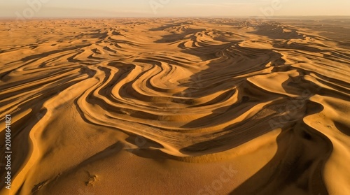 Vászonkép Aerial view of sand dunes in the desert, flowing sandy contours and layered ridg
