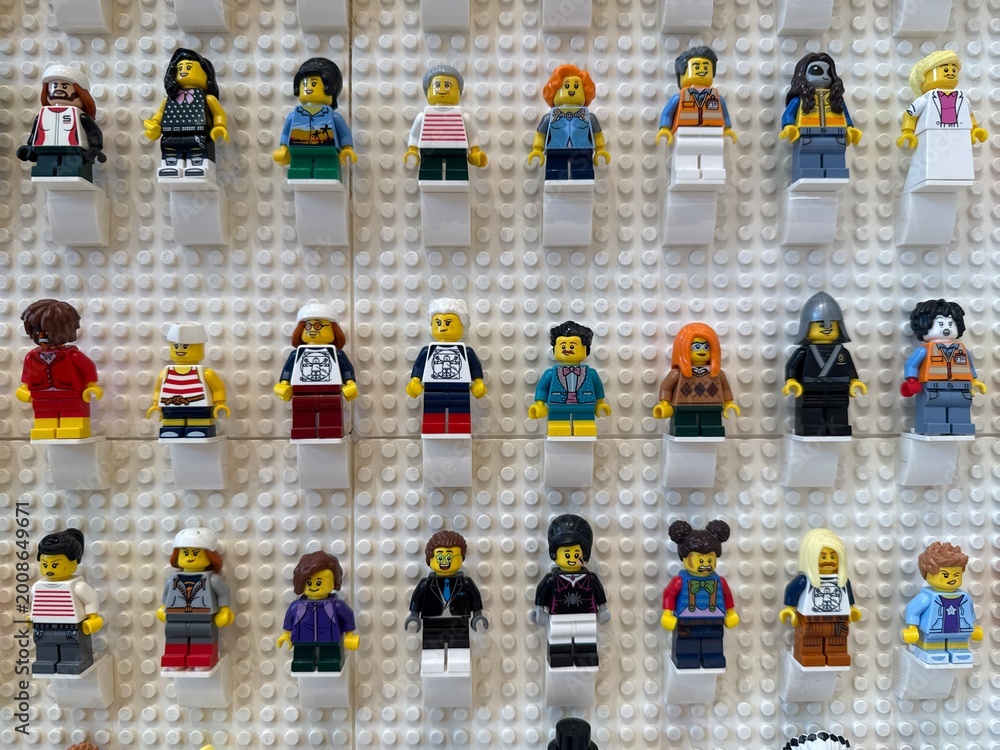 Fototapeta premium April 2026, Singapore: LEGO minifigures displayed on a white wall.
