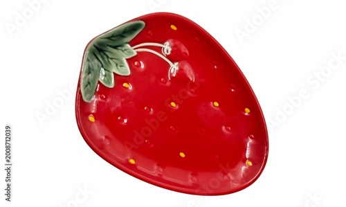 Schilderij op canvas Top view of a red vibrant strawberry-shaped ceramic trinket dish, isolated on white background