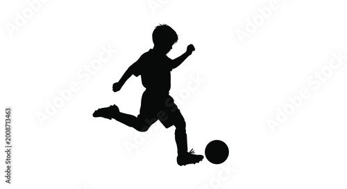 Boy kicking soccer ball dynamic action silhouette