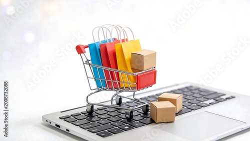 Mini shopping cart on laptop keyboard