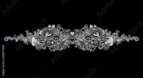 Symmetrical silver filigree ornament with swirling floral scrolls, intricate vine patterns, and small pastel heart accents on a black background
