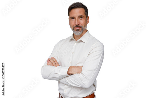 Schilderij op canvas Confident mature man with beard standing arms crossed smiling, professional busi