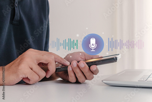 A man using an AI voice chat assistant on his smartphone