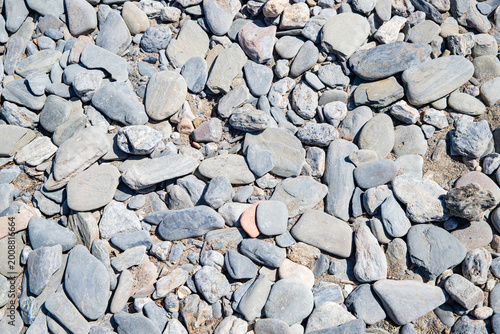 Photography natural background made of smooth stones and river gravel
