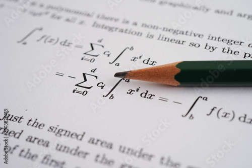 Pencil on mathematic formula exercise test paper in education school.