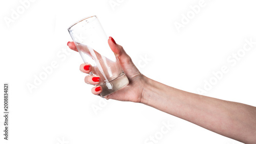 Woman hand holding empty glass on white background.