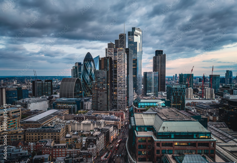 Fototapeta premium Panoramic aerial view of the illuminated City of London skyline with office skyscrapers and street traffic at Bishopsgate and Liverpool Street