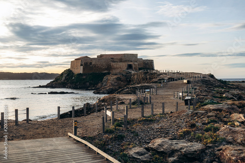 Fort du Pradeau near Port de la Tour Fondue at sunrise, coastal path leading to historic fortress overlooking the Mediterranean Sea