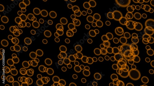 Numerous vibrant orange ring shapes illuminate the darkness.
