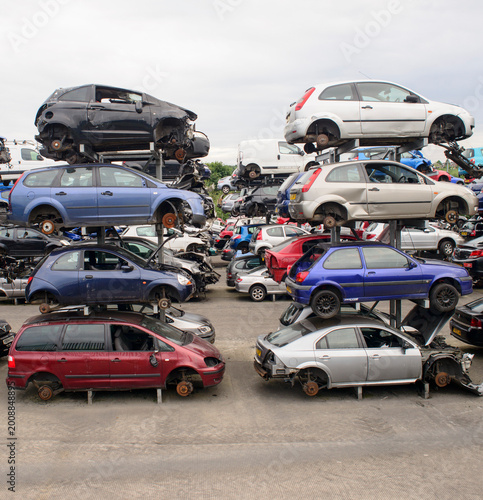 Fotografie Stacked cars in salvage / breakers yard