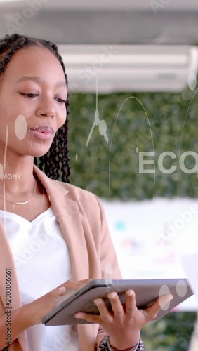 Vertical video: Woman holding tablet after opening eyes, tapping and swiping, showing ECO graphics