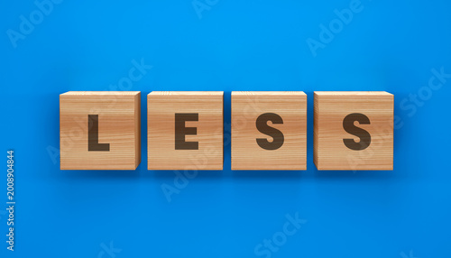 Photos The Art of Reduction: Wooden blocks arrange to spell out LESS, offering a thought-provoking visual for various contexts