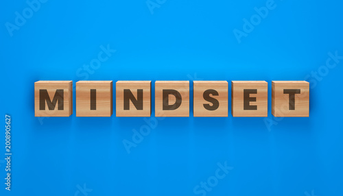 Foto Mindset Wooden Blocks on Blue Surface: The word MINDSET is spelled out with wooden blocks on a vibrant blue surface, a visual representation of focus and attitude