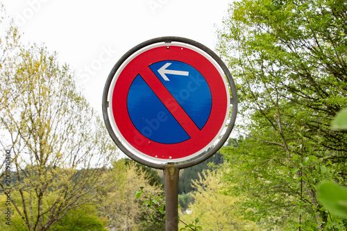 No Parking Traffic Sign with Left Arrow on Street, Restriction Road Symbol