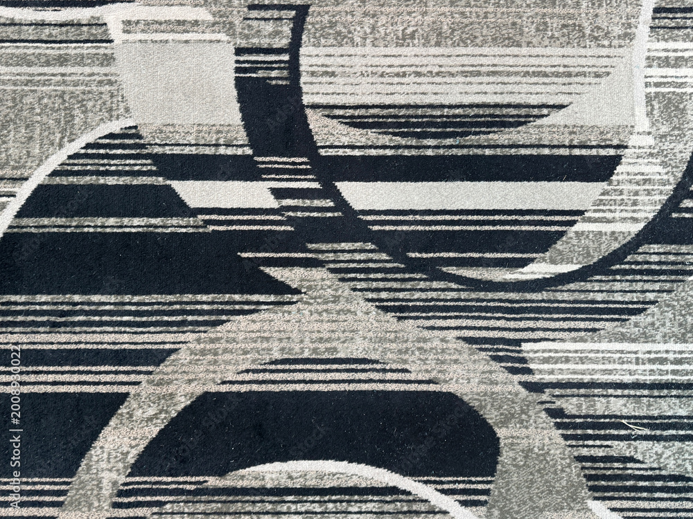 Naklejka premium Random abstract monochrome carpet flooring suitable for hotel and high end floor finishes, in beige and black pattern. Seamless texture.