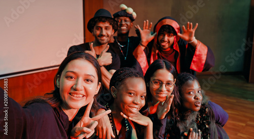 Photography Indian young adult gen z male man female look camera take selfie photos have fun joy hall stage place
