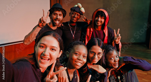 Cuadro en lienzo Indian young adult gen z male man female look camera take selfie photos have fun joy hall stage place