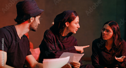 Canvastavla Indian young adult gen z male man female group hold script paper read new story