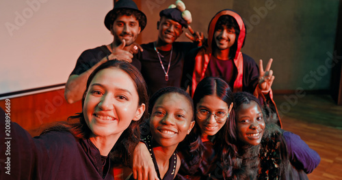 Photography Indian young adult gen z male man female look camera take selfie photos have fun joy hall stage place