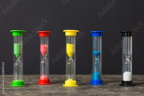 hourglass on the table, sand clock as time passing concept for business deadline, copy space