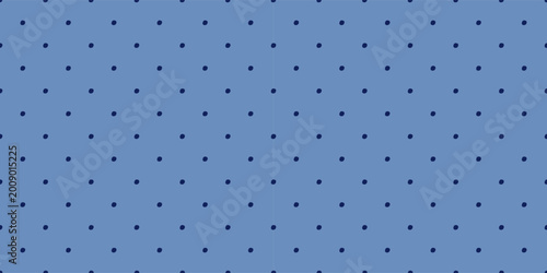 Blue hand drawn polka dot seamless pattern, navy dots on blue background. Retro-inspired background.