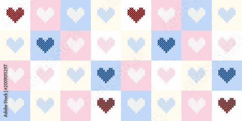Seamless patchwork pattern with cross-stitch hearts in pastel colors.