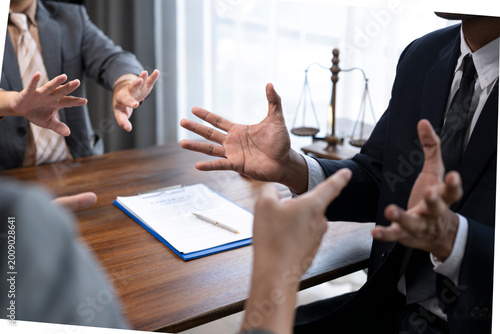 Lawyers discussing a case with expressive hand gestures