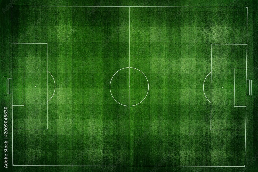 Obraz premium Aerial view of a textured green soccer field with clear white line markings and a worn, realistic grass surface. An empty professional football pitch from above, ready for competition or training.