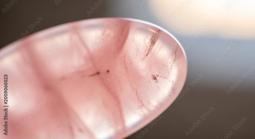 Fototapeta premium Close-up of a Pink Quartz Crystal with Internal Inclusions.