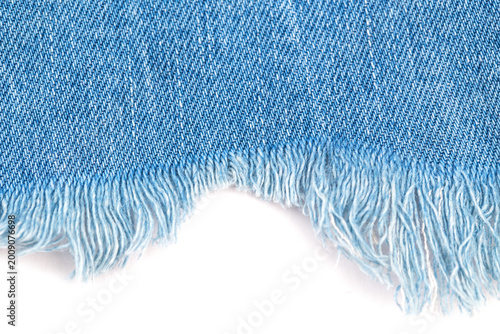 Obraz na plátně Cotton fabric in light blue color with frayed edges showing texture and detail o