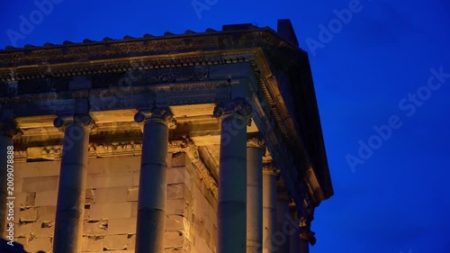 Side view detail of Garni Temple carvings illuminated at dusk in Armenia