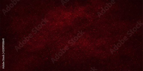 A vintage red grunge texture with a dark aged paint design creates a grungy wallpaper backdrop featuring an old textured paper pattern for retro art material