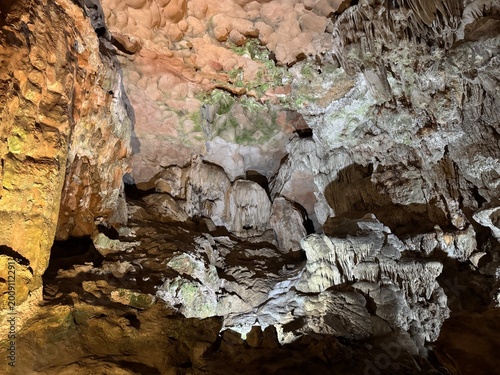 Cuadro en lienzo Magnificent cave walls and ceiling texture displaying stalactites and stalagmites with karst and natural limestone rock formations carved by nature