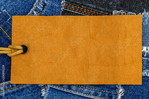 Canvastavla Blank tag on denim fabric with stitching and texture details visible in close-up