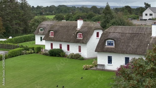 Typical Irish White Washed Houses with Thatched Roof. Authentic and Historical Cozy Cottage in Ireland, Aerial View