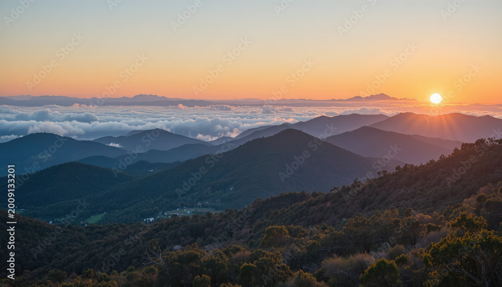 Obraz premium Sunset over mountain range with trees and foggy valleys below 1 (273).png