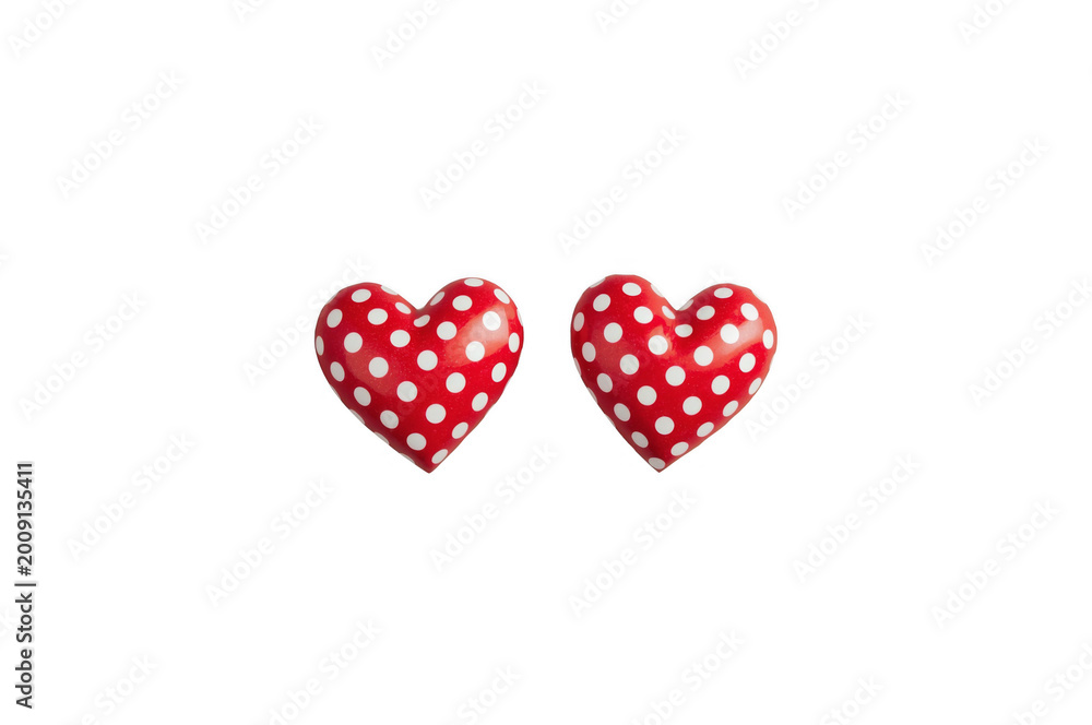 Obraz premium Red polka dot hearts symbolizing love and romance