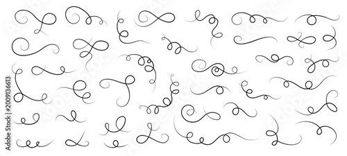 Foto Collection of variegated curling calligraphy ornaments, looping flourishes with thick and thin strokes, scattered across white background