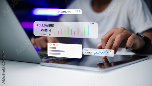 Digital marketing professional analyzing social media analytics and followers growth on tablet
