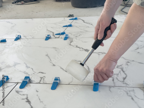 Aligning floor tiles with care