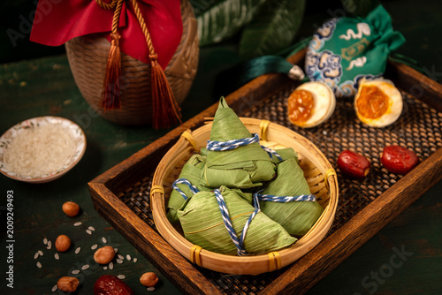 Traditional zongzi rice dumplings for Dragon Boat Festival on rustic tray