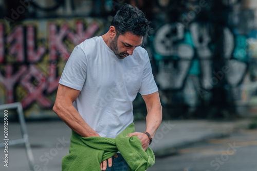 Tablou pe pânză young brunette caucasian man on the street outdoors