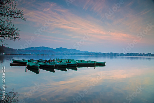 Εκτύπωση καμβά Rowboats on West Lake at Dawn, Hangzhou, China