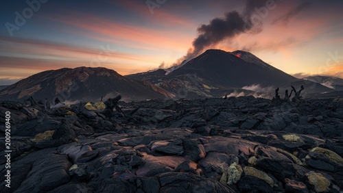 Volcanic Landscape with Erupted Lava and Smoke during Sunset