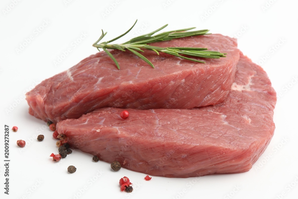 Fototapeta premium Pieces of raw beef meat and spices on white background