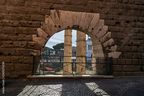 Arco dei Pantani Stone Archway Framing Ancient Columns of the Forum of Augustus in Rome