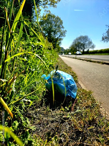 Keep Britain Tidy volunteer litter picking rubbish in UK park – environmental cleanup and community action