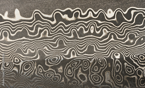Macro surface of the Damascus steel blade with a unique wavy pattern